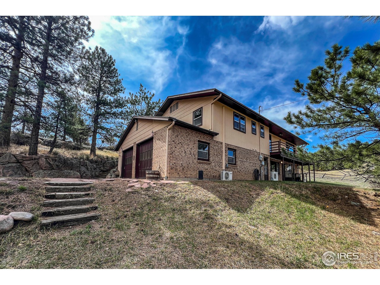 135 Lake Drive Lyons, CO 80540 - Photo 25 of 39 a view of a house with a yard