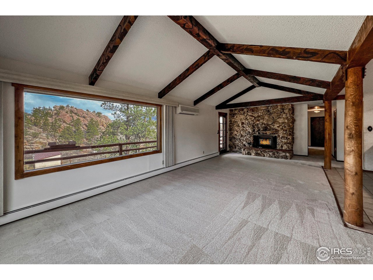 135 Lake Drive Lyons, CO 80540 - Photo 5 of 39 a view of empty room with wooden floor