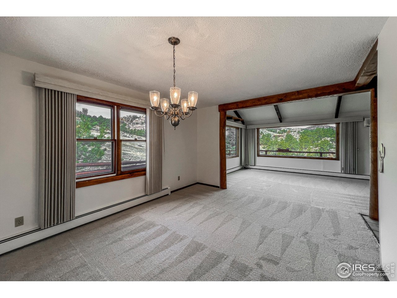 135 Lake Drive Lyons, CO 80540 - Photo 6 of 39 a view of an empty room with a window
