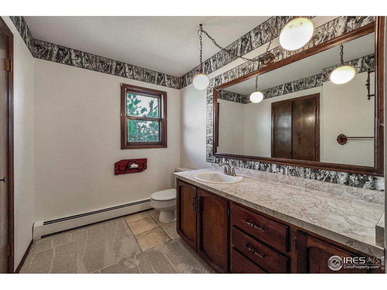 135 Lake Drive Lyons, CO 80540 - Photo 7 of 39 a bathroom with a sink and a mirror