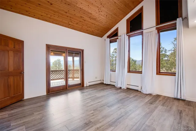 a view of entryway with wooden floor
