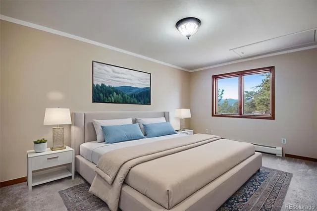 a bedroom with a bed and a painting on the wall