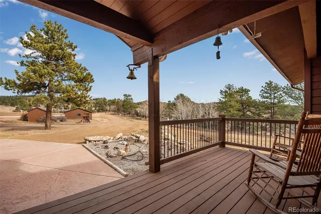 a view of a balcony with wooden floor