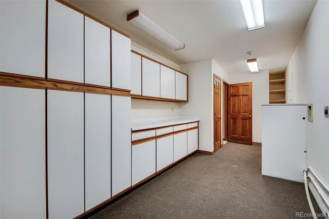 a view of a kitchen with electric appliances