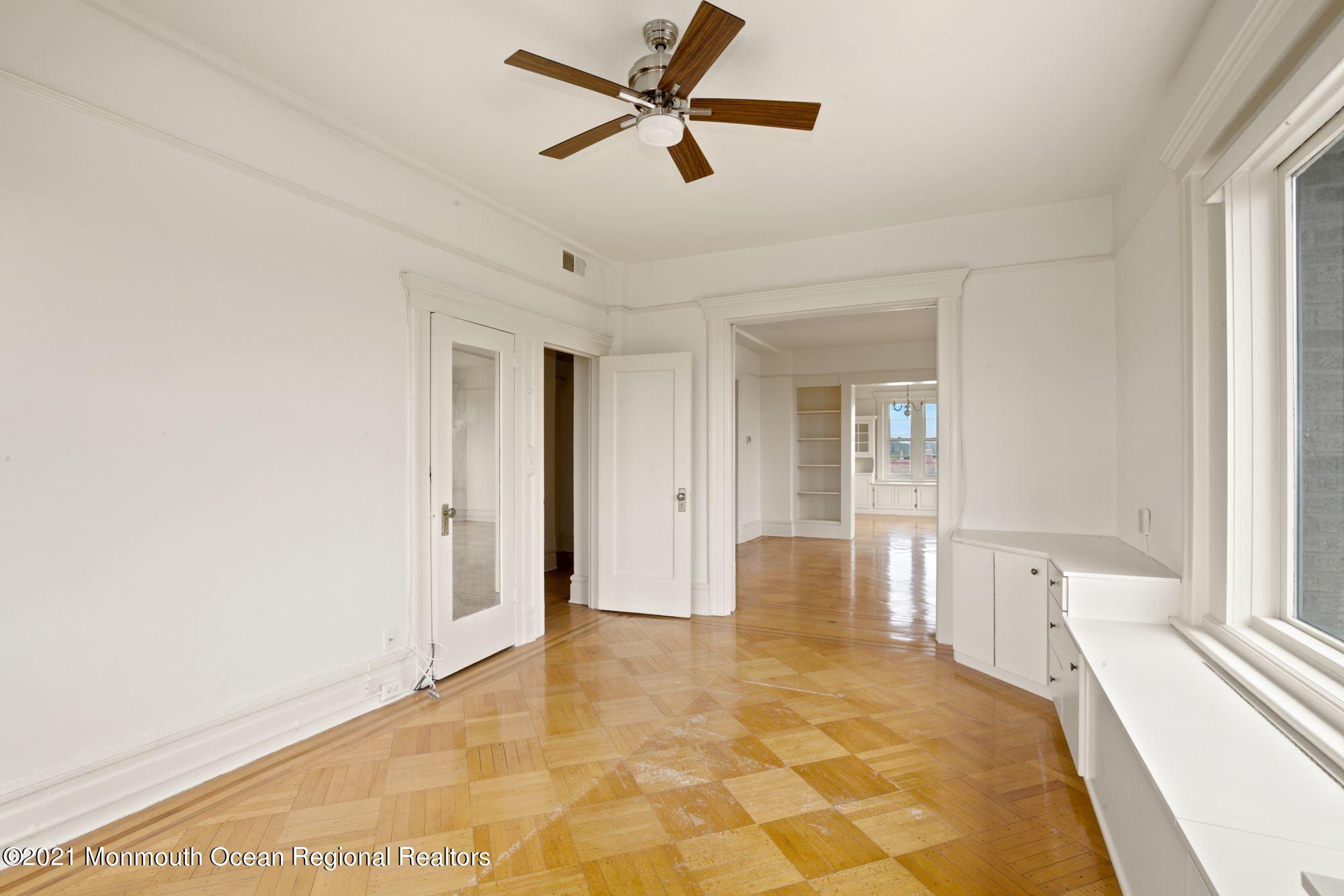 57 Union Street, Unit C4071 Montclair, NJ 07042 - Photo 13 of 27 a view of a livingroom with a chandelier fan and windows