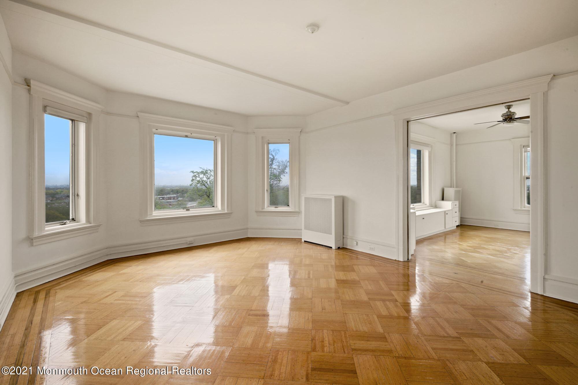 57 Union Street, Unit C4071 Montclair, NJ 07042 - Photo 3 of 27 a view of an empty room with window and wooden floor