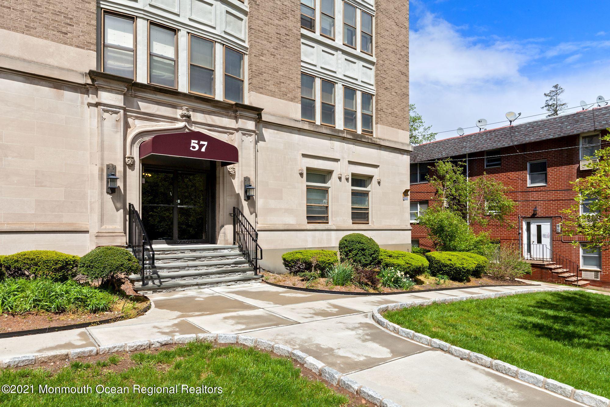 57 Union Street, Unit C4071 Montclair, NJ 07042 - Photo 27 of 27 a front view of a house with a yard and potted plants