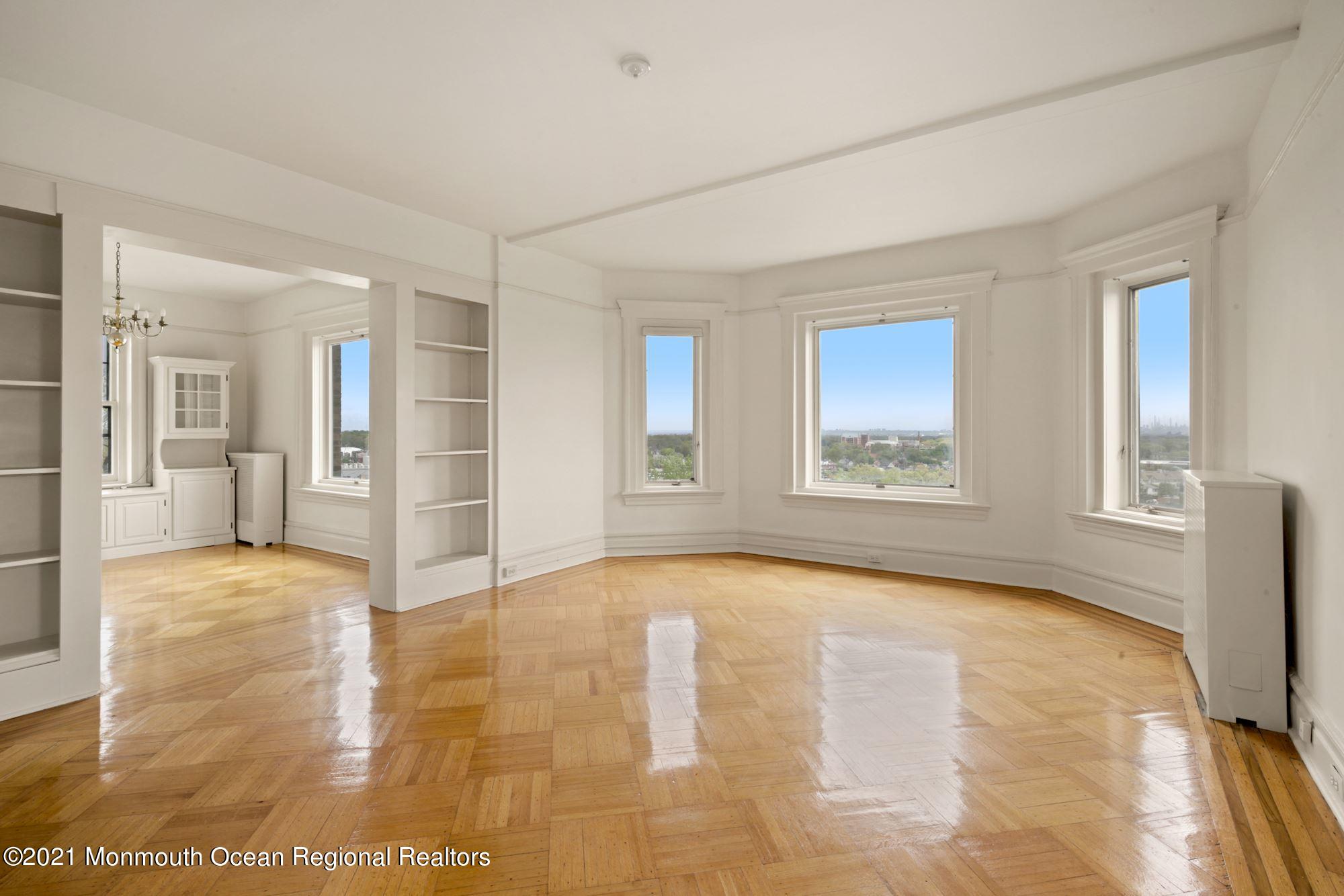 57 Union Street, Unit C4071 Montclair, NJ 07042 - Photo 4 of 27 a view of an empty room with window and wooden floor