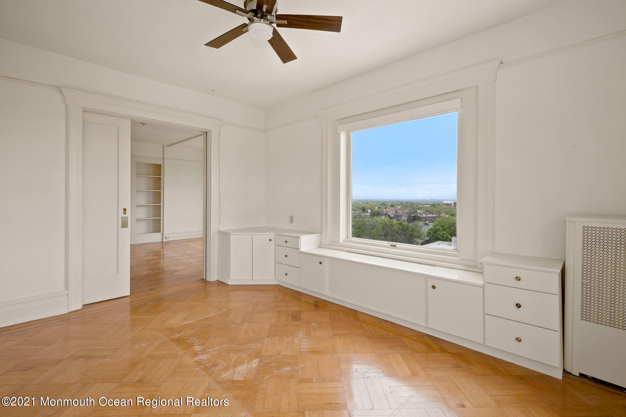 57 Union Street, Unit C4071 Montclair, NJ 07042 - Photo 8 of 27 a view of a livingroom with a ceiling fan and window