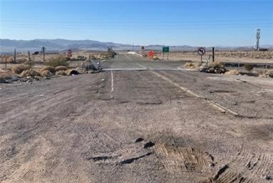 0 Th Baker, CA 92309 - Photo 11 of 17 a view of a dry yard with trees