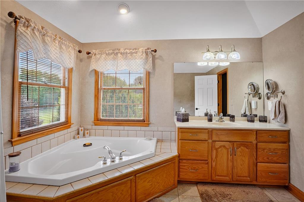 660 Allison Hollow Road Houston, PA 15342 - Photo 23 of 49 a bathroom with a tub sink and mirror
