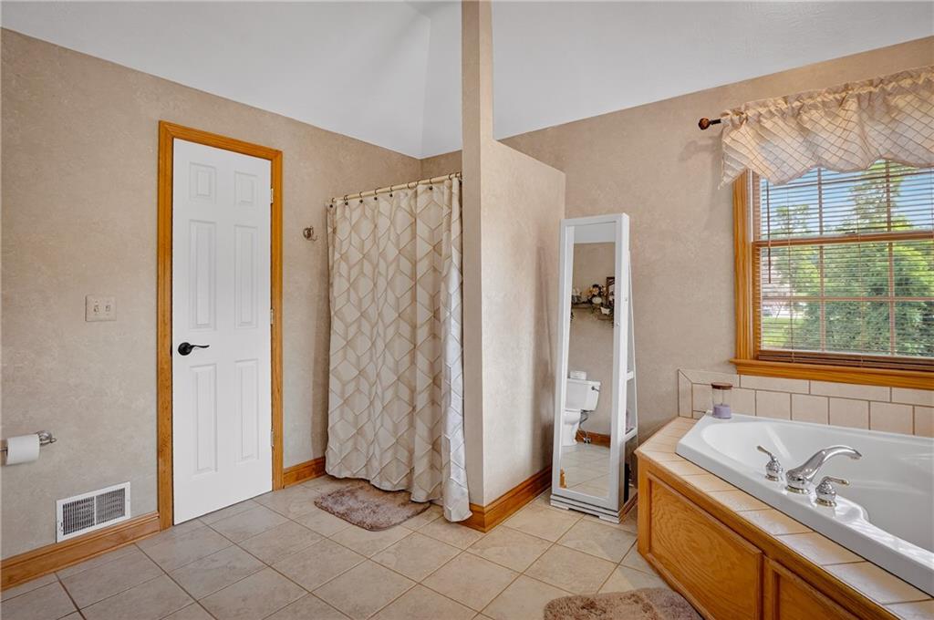 660 Allison Hollow Road Houston, PA 15342 - Photo 25 of 49 a bathroom with a tub a sink and a shower