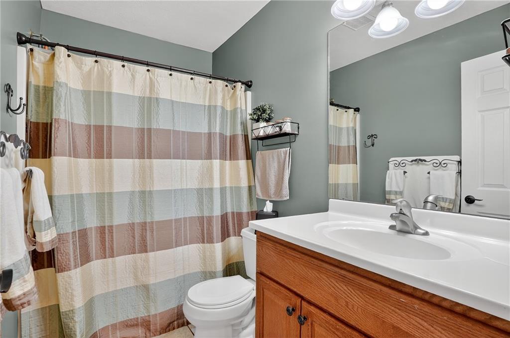 660 Allison Hollow Road Houston, PA 15342 - Photo 29 of 49 a bathroom with a sink a toilet a mirror and shower