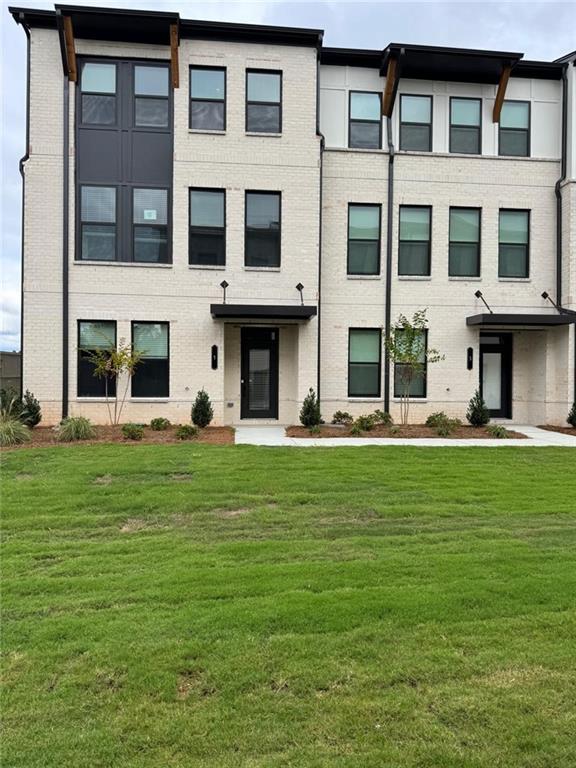 1 Peeples Drive Lawrenceville, GA 30046 - Photo 2 of 11 a front view of a building with a garden