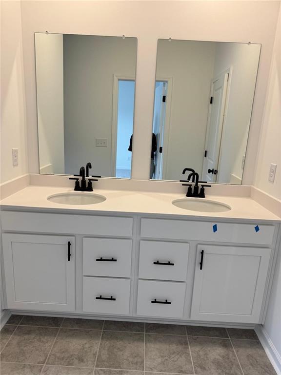 1 Peeples Drive Lawrenceville, GA 30046 - Photo 8 of 11 a bathroom with a sink and a mirror
