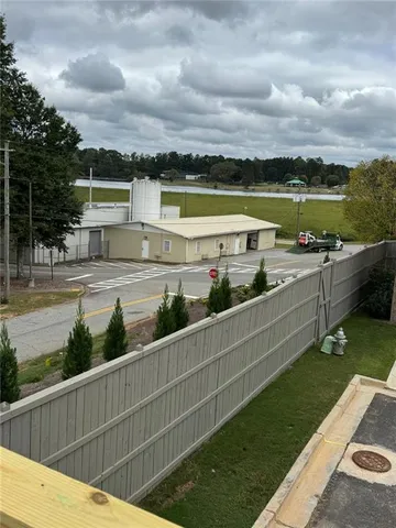 a view of a swimming pool with an outdoor seating and a garden
