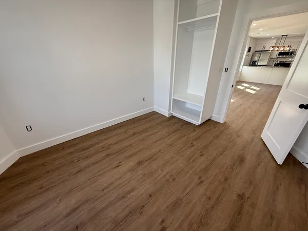a view of a kitchen from the hallway