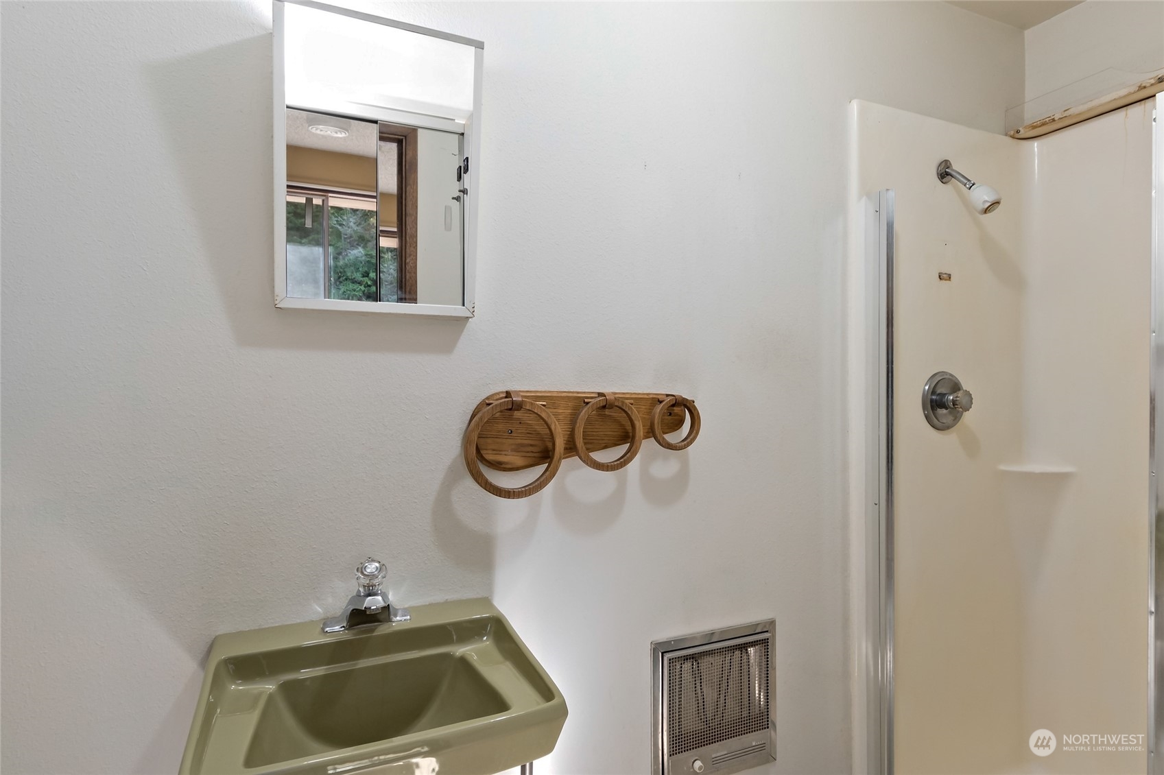 739 West Banta Road Oak Harbor, WA 98277 - Photo 12 of 40 a bathroom with a sink and a mirror