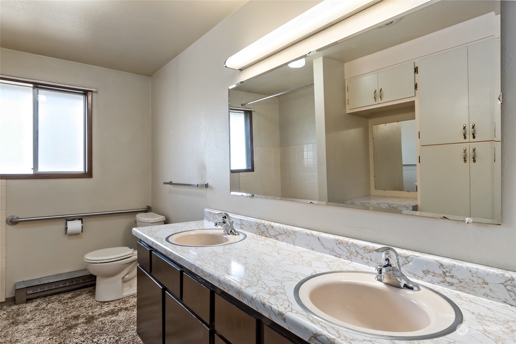 739 West Banta Road Oak Harbor, WA 98277 - Photo 13 of 40 a bathroom with a granite countertop sink and a large mirror