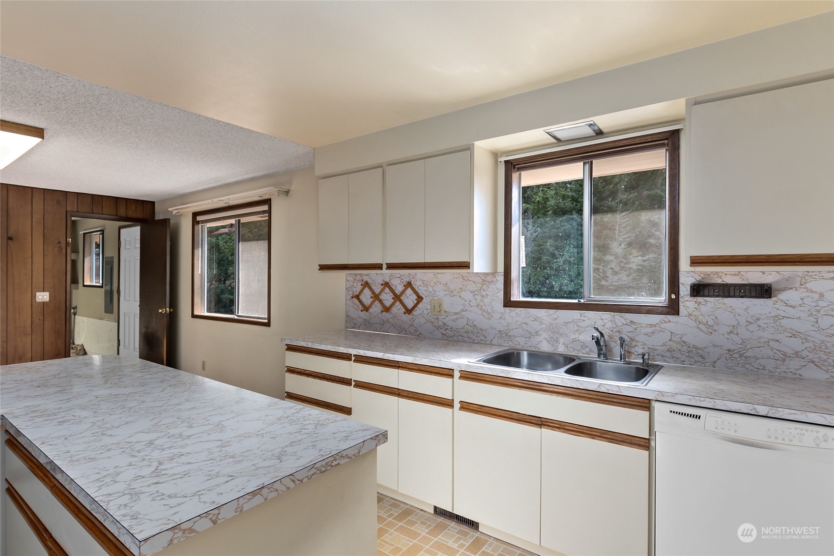 739 West Banta Road Oak Harbor, WA 98277 - Photo 4 of 40 a view of a kitchen with granite countertop sink and window