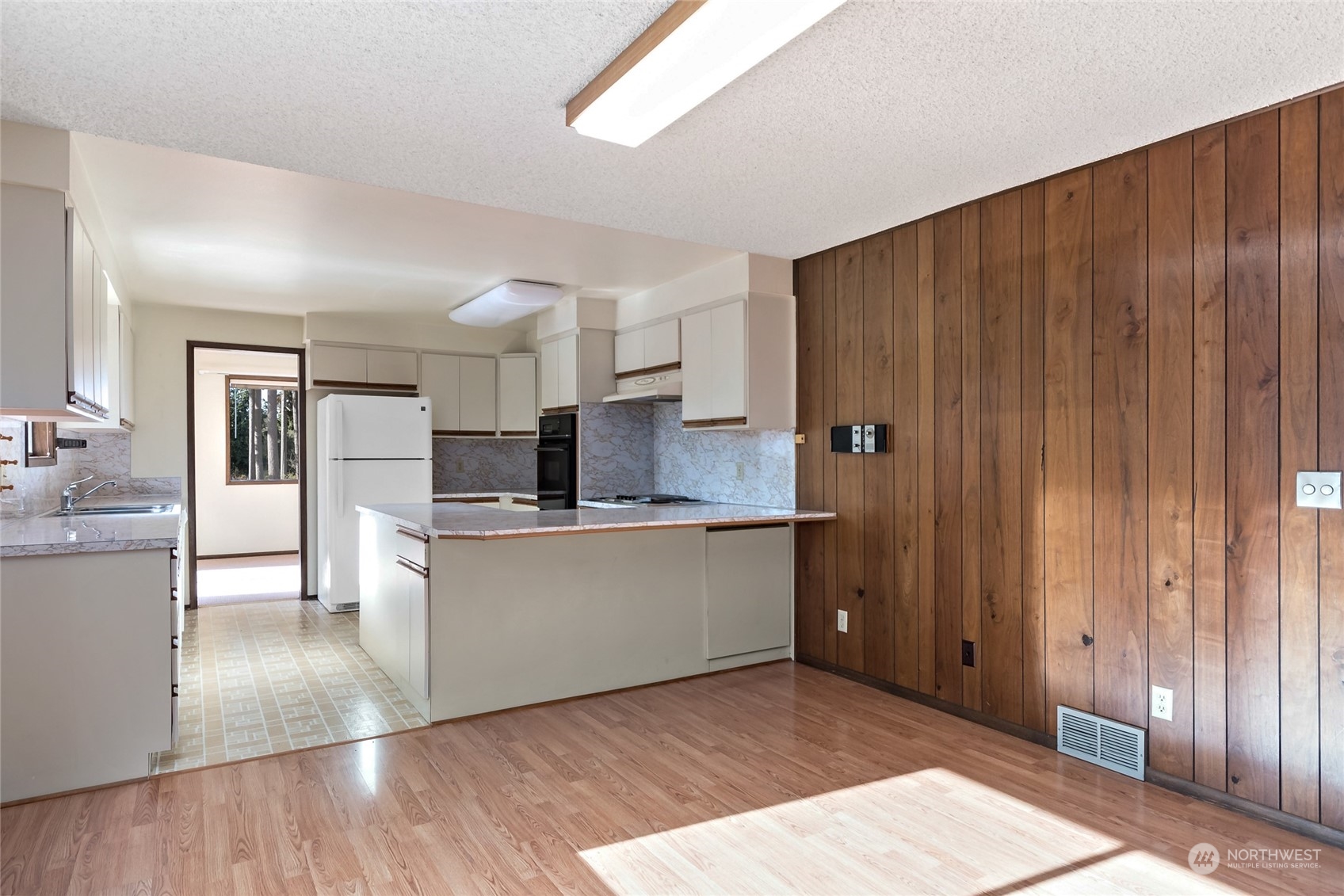 739 West Banta Road Oak Harbor, WA 98277 - Photo 7 of 40 a kitchen with stainless steel appliances granite countertop a refrigerator and a sink