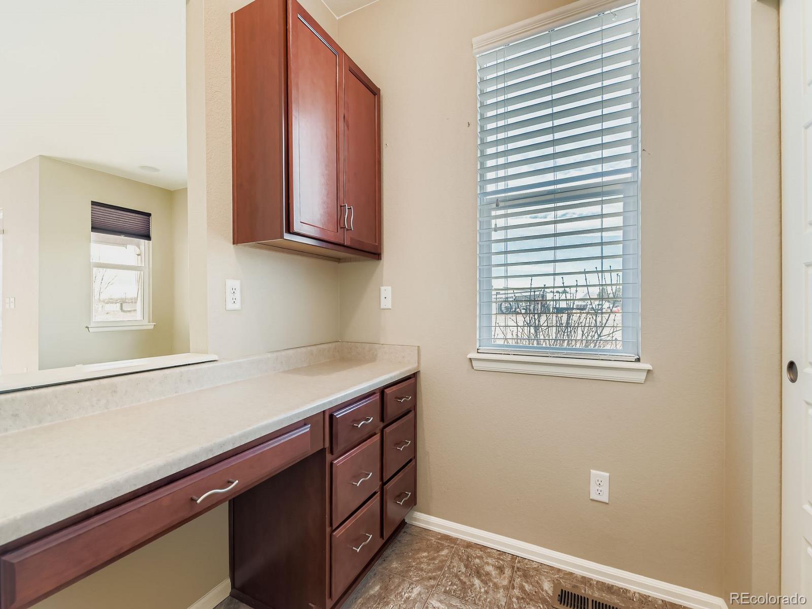 8645 Raspberry Drive Frederick, CO 80504 - Photo 19 of 29 a room with cabinets and window