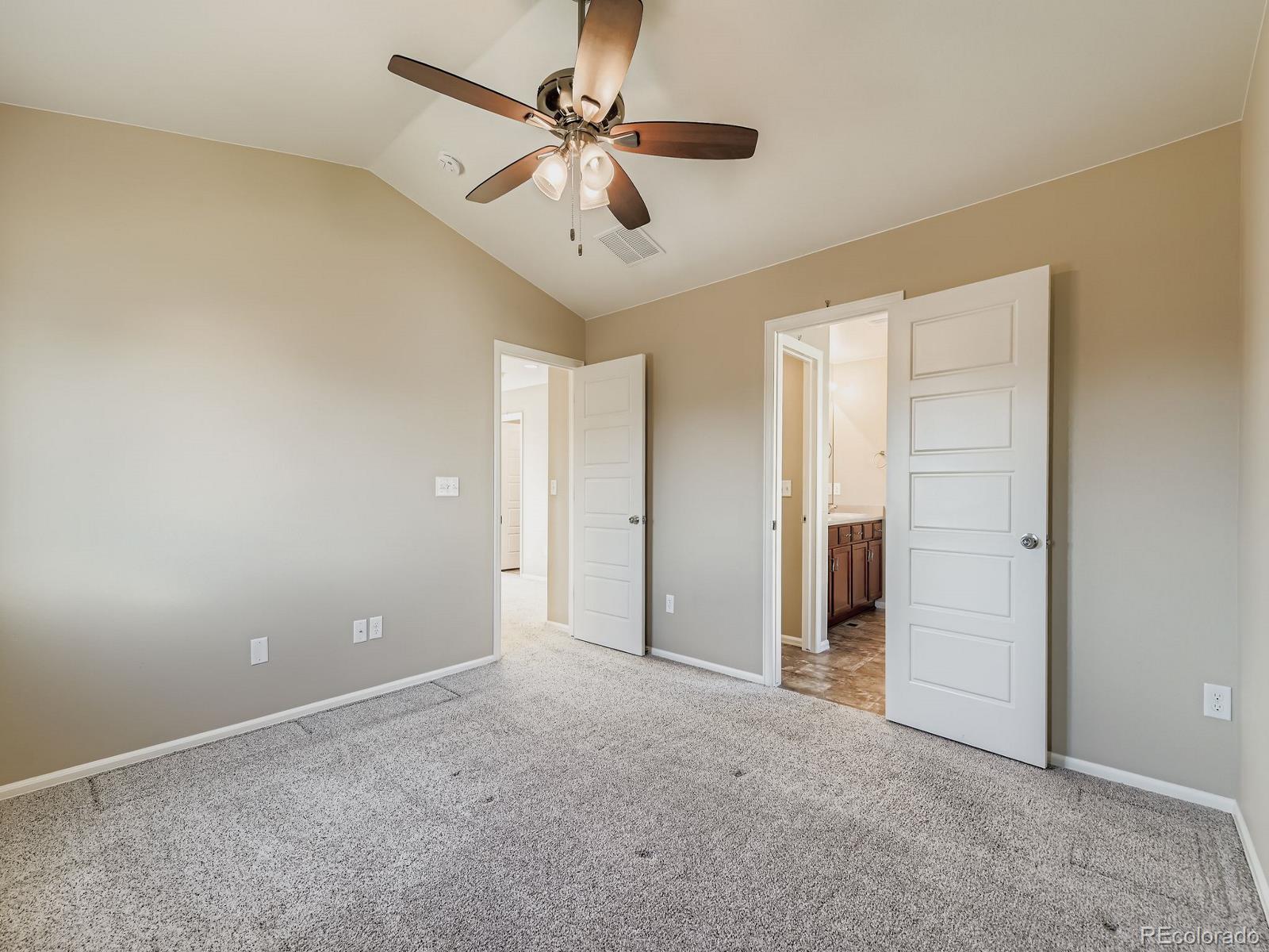 8645 Raspberry Drive Frederick, CO 80504 - Photo 22 of 29 an empty room with closet and a ceiling fan