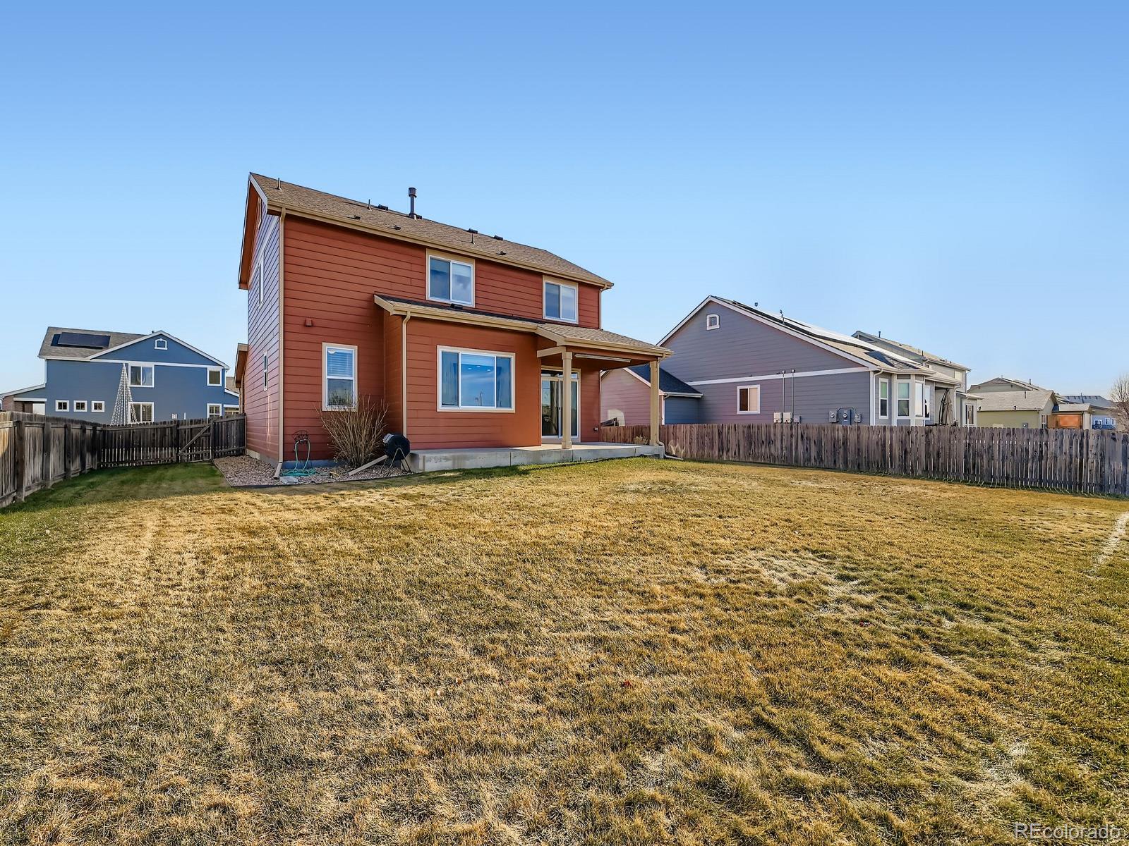 8645 Raspberry Drive Frederick, CO 80504 - Photo 6 of 29 a front view of a house with a yard