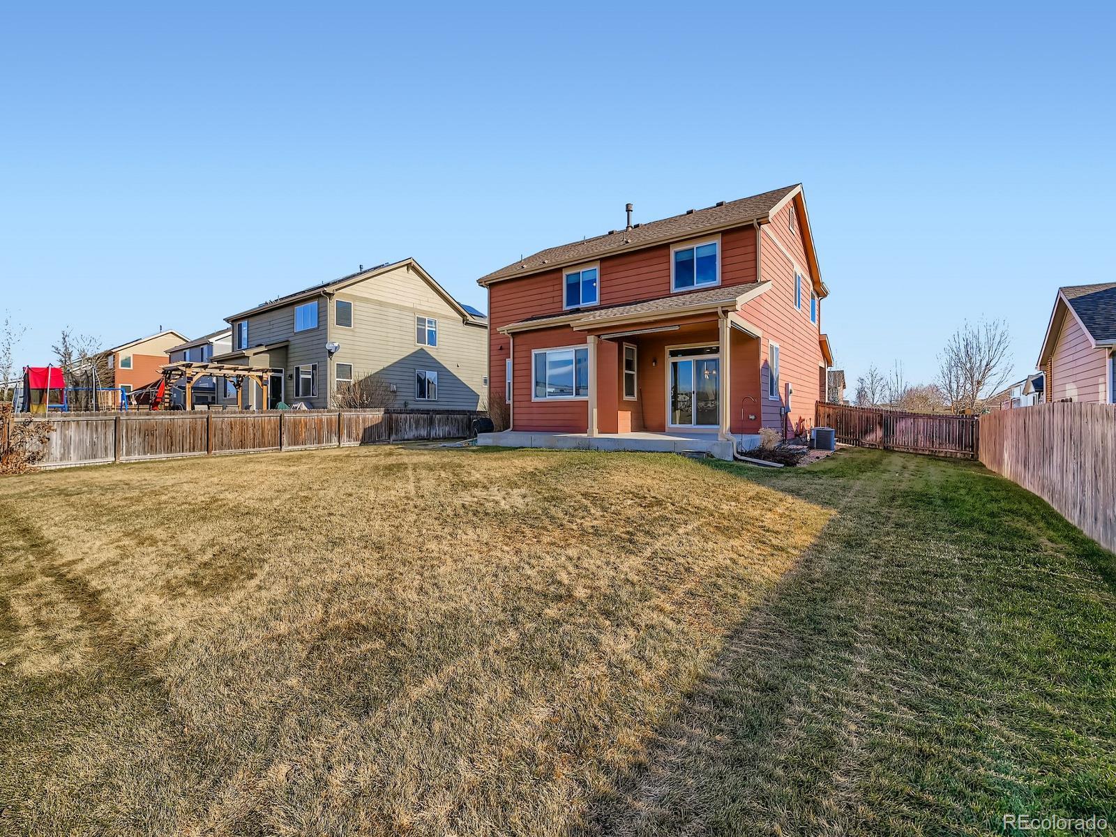 8645 Raspberry Drive Frederick, CO 80504 - Photo 7 of 29 a front view of house with yard and trees in the background