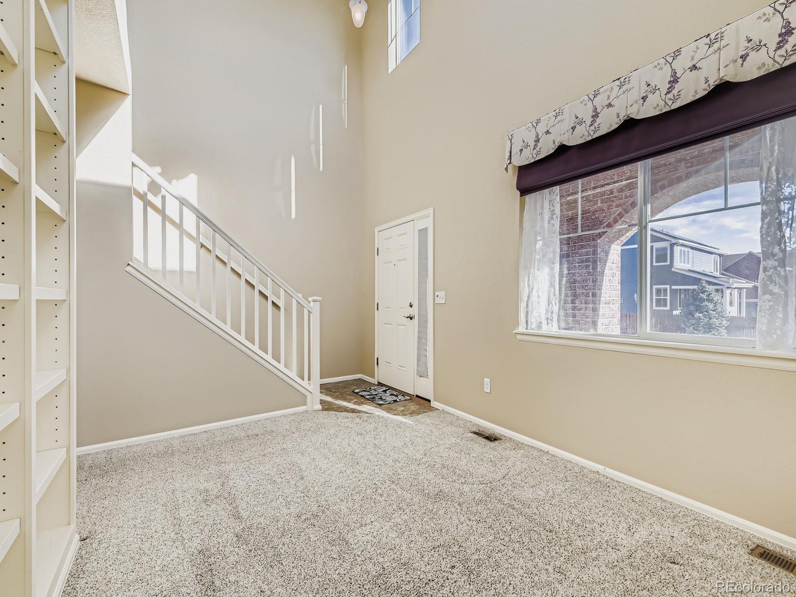 8645 Raspberry Drive Frederick, CO 80504 - Photo 8 of 29 a view of an entryway with a window