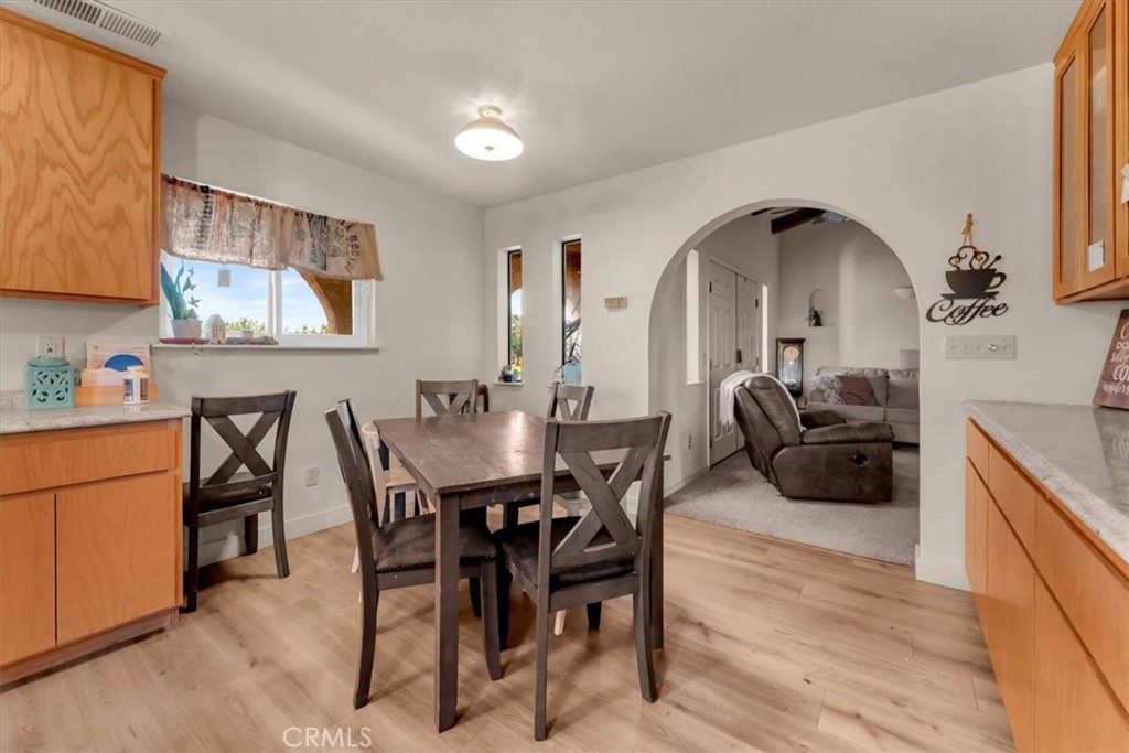 21550 Leaf Avenue Corning, CA 96021 - Photo 13 of 71 a view of a dining room with furniture and chandelier