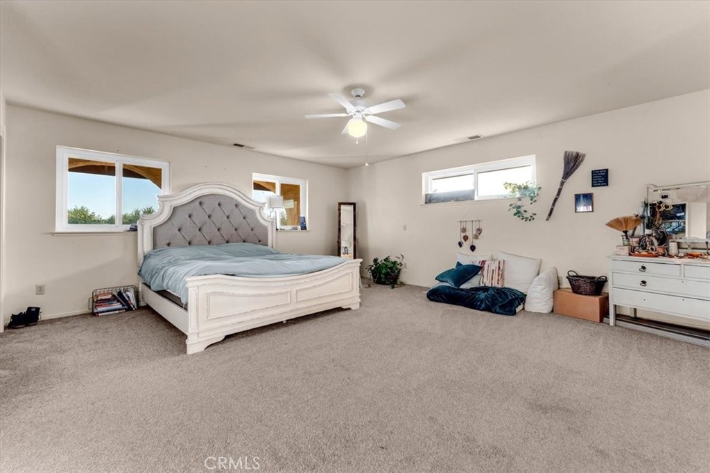 21550 Leaf Avenue Corning, CA 96021 - Photo 14 of 71 a bedroom with furniture and a ceiling fan