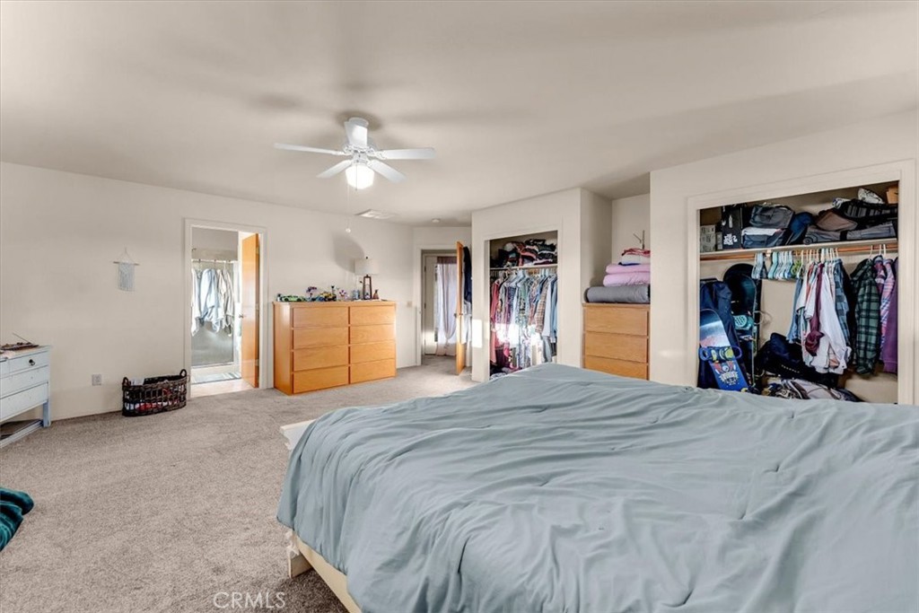 21550 Leaf Avenue Corning, CA 96021 - Photo 16 of 71 a bed room with a bed and a walk in closet