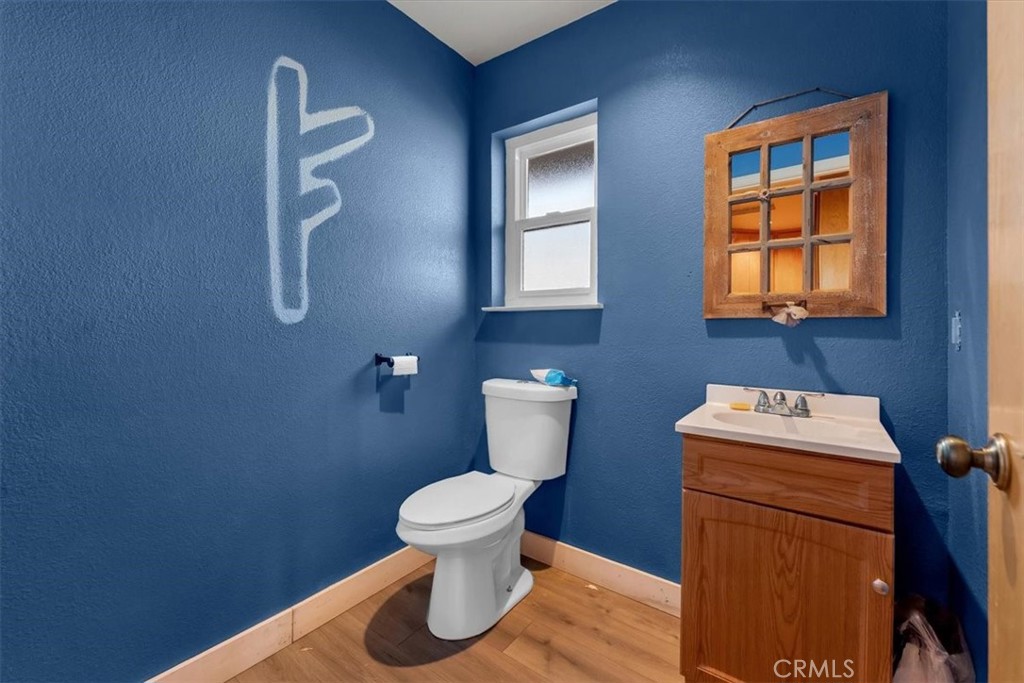 21550 Leaf Avenue Corning, CA 96021 - Photo 27 of 71 a bathroom with a toilet sink and mirror