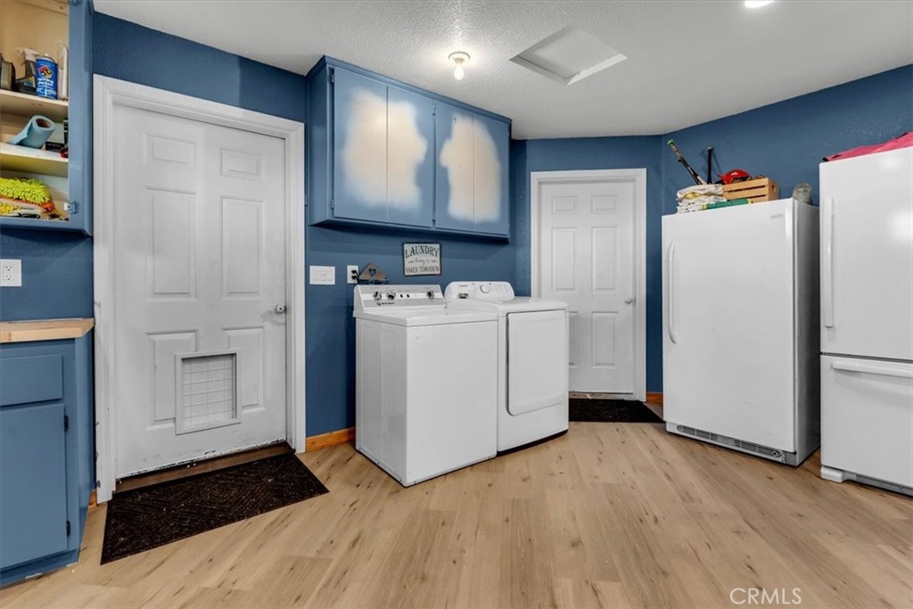 21550 Leaf Avenue Corning, CA 96021 - Photo 30 of 71 a view of a storage & utility room with washer and dryer