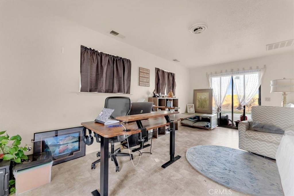 21550 Leaf Avenue Corning, CA 96021 - Photo 33 of 71 a living room with furniture and a large window