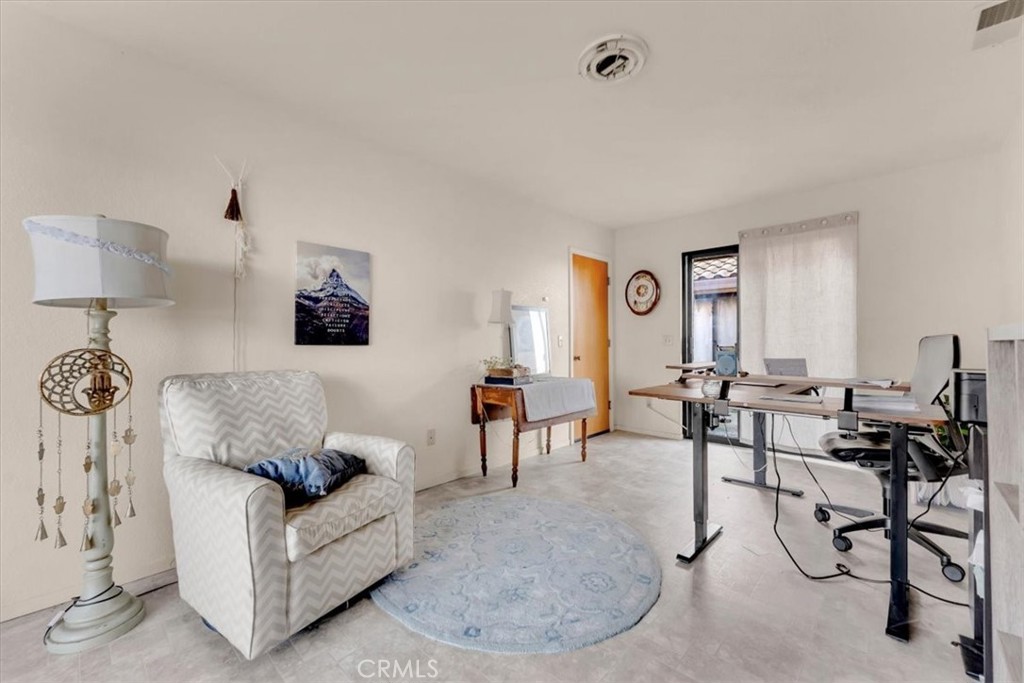 21550 Leaf Avenue Corning, CA 96021 - Photo 36 of 71 a living room with furniture and a lamp