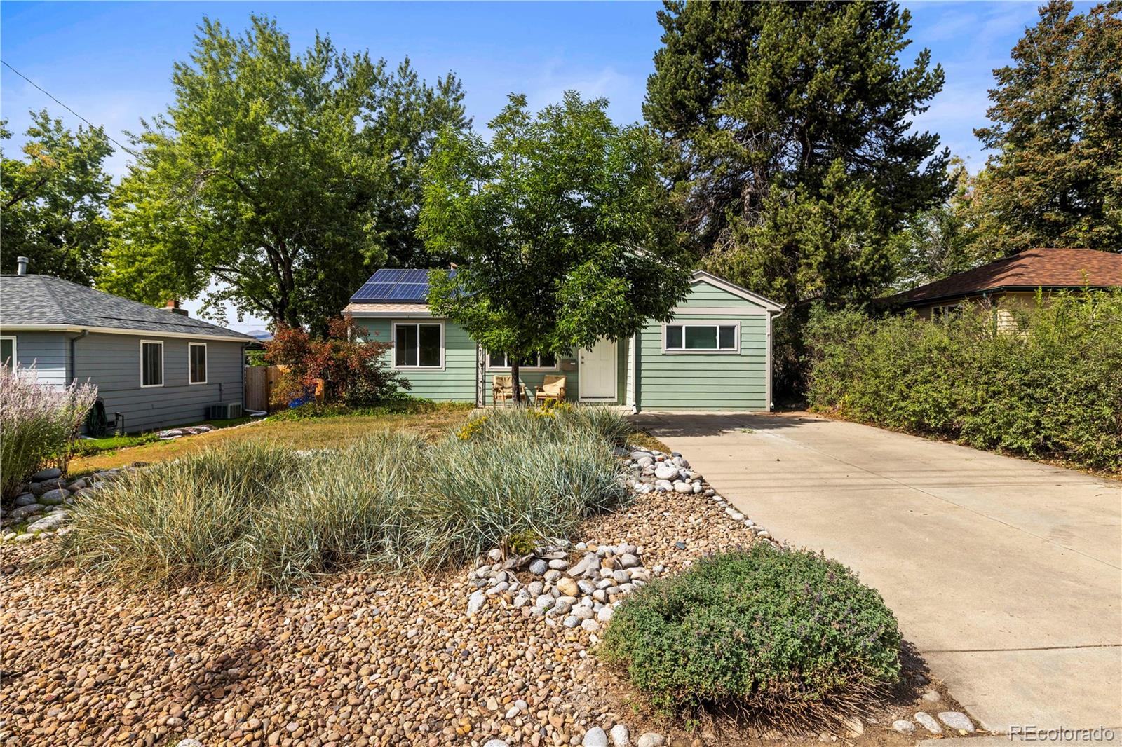 2845 Fenton Street Wheat Ridge, CO 80214 - Photo 3 of 50 a front view of a house with a yard and garage