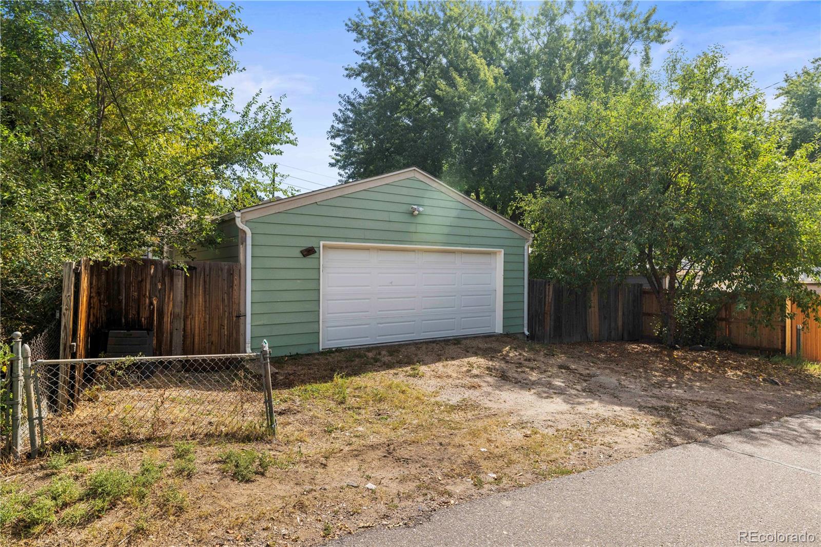 2845 Fenton Street Wheat Ridge, CO 80214 - Photo 33 of 50 a front view of a house with a yard and garage