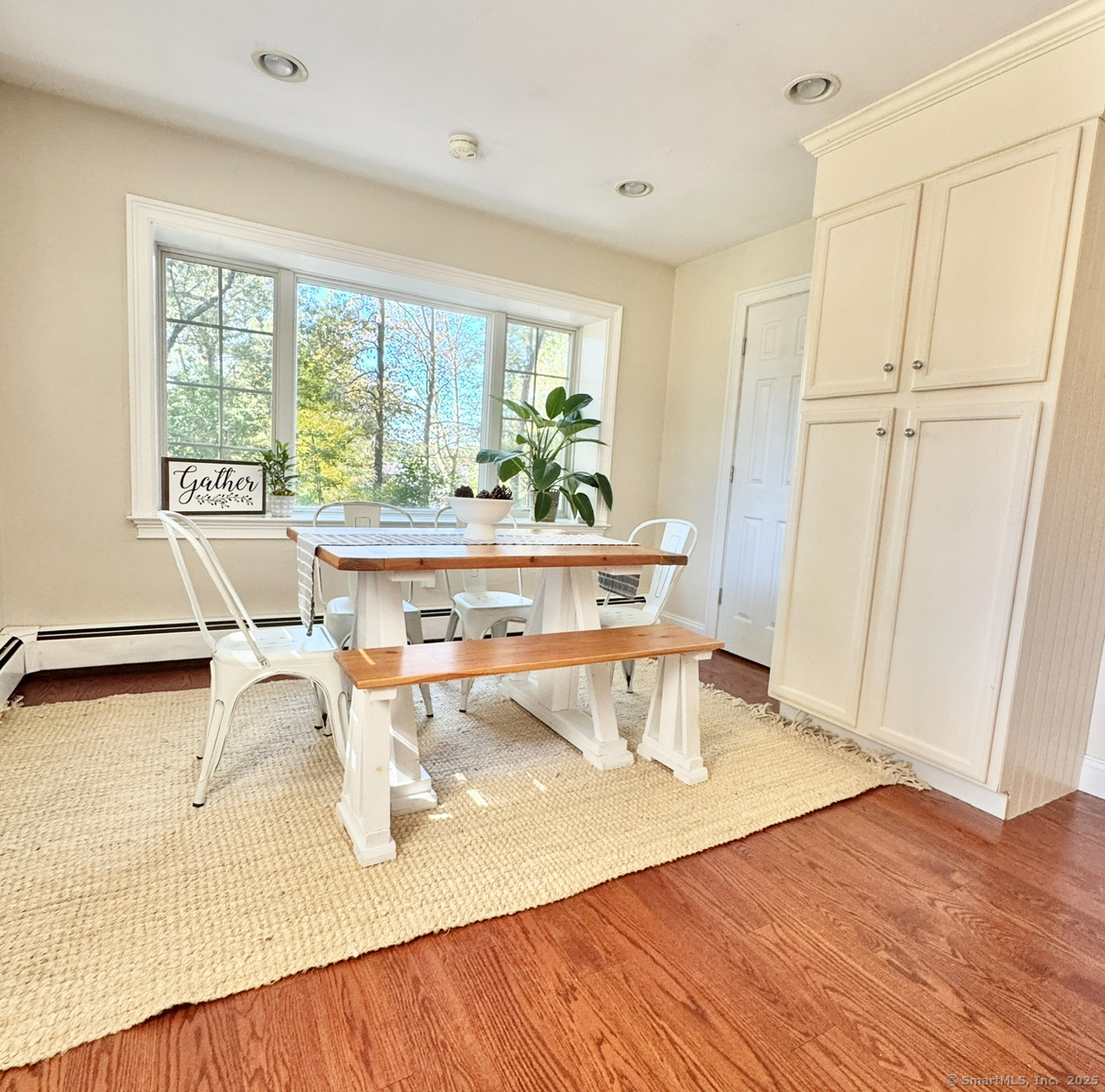 357 Harvester Road Fairfield, CT 06825 - Photo 4 of 10 a living room with a couch and a table