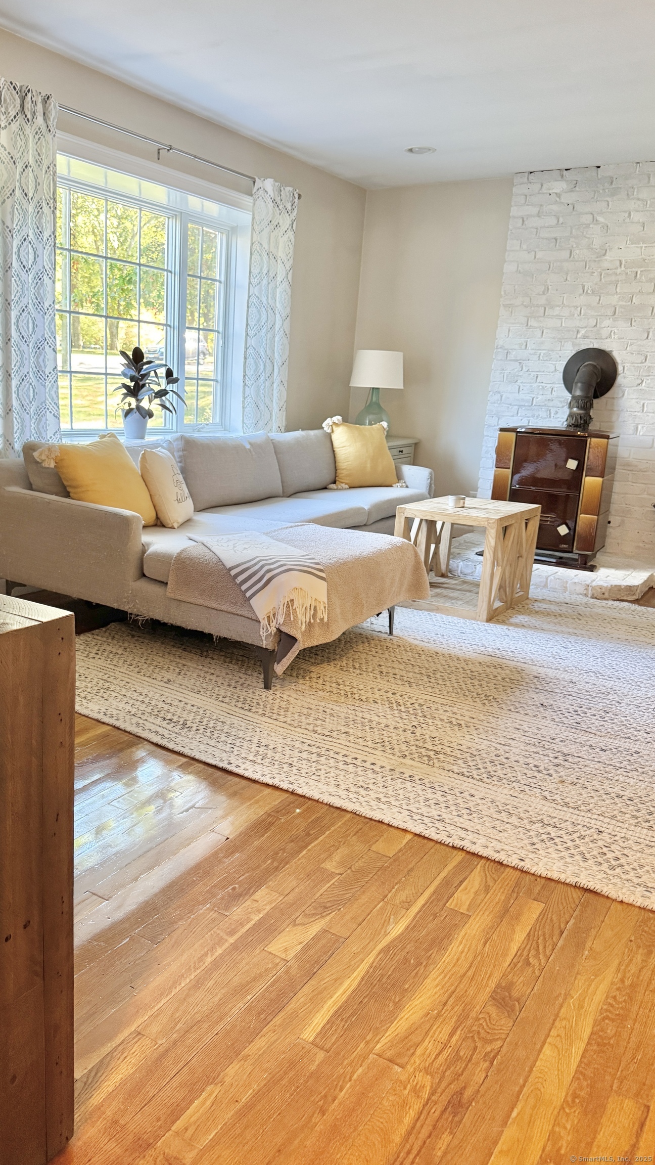 357 Harvester Road Fairfield, CT 06825 - Photo 6 of 10 a living room with furniture and a large window