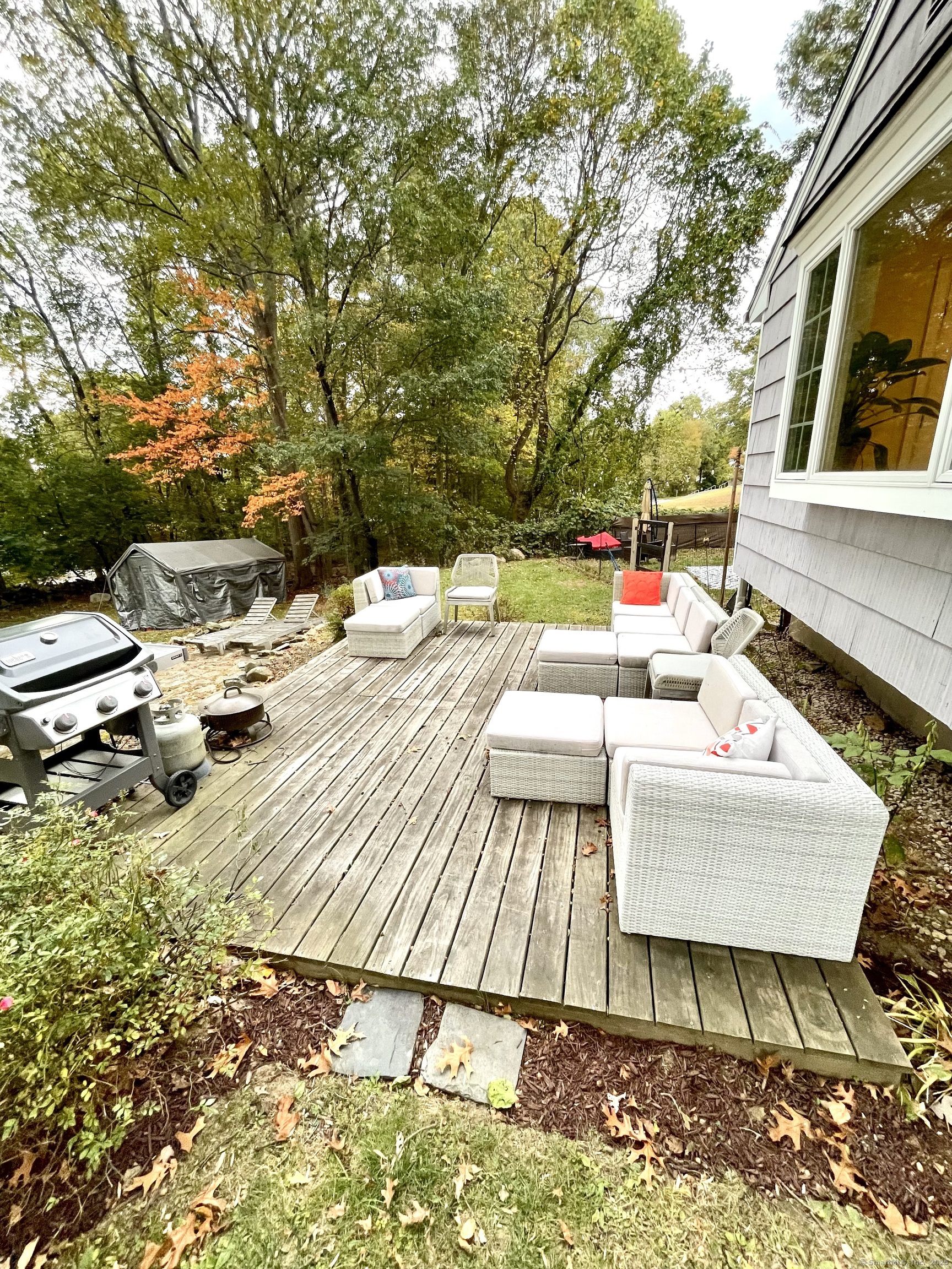 357 Harvester Road Fairfield, CT 06825 - Photo 9 of 10 a view of backyard of a house with seating space