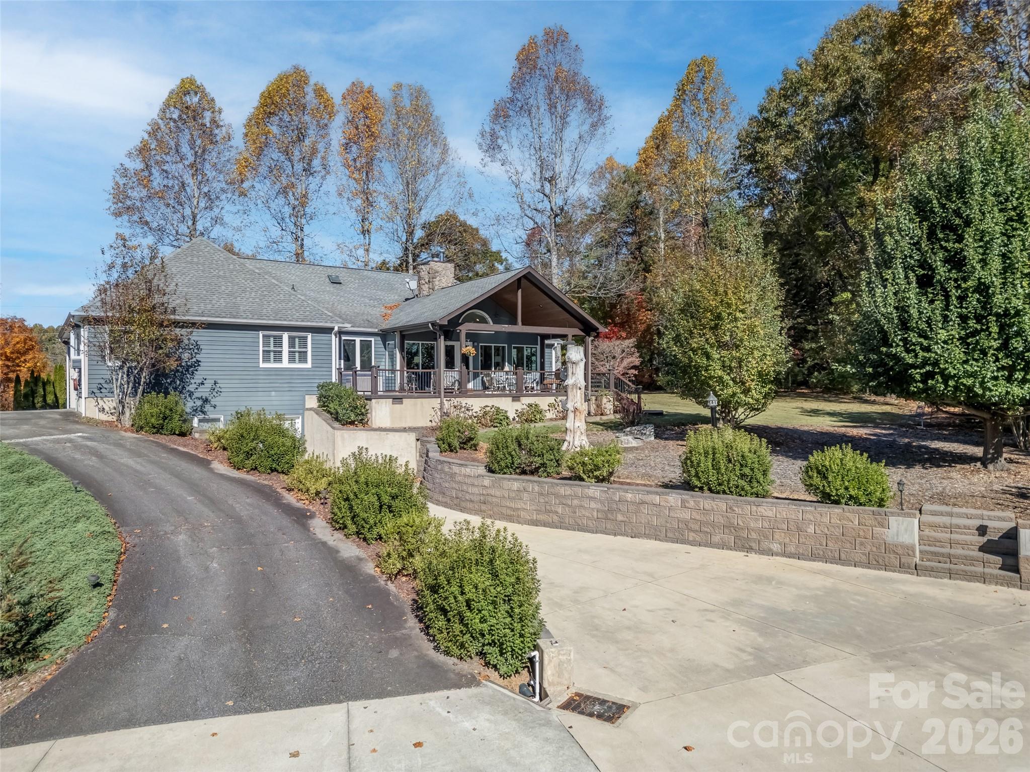 1340 Macedonia Road Saluda, NC 28773 - Photo 5 of 45 a front view of a house with a yard and garage