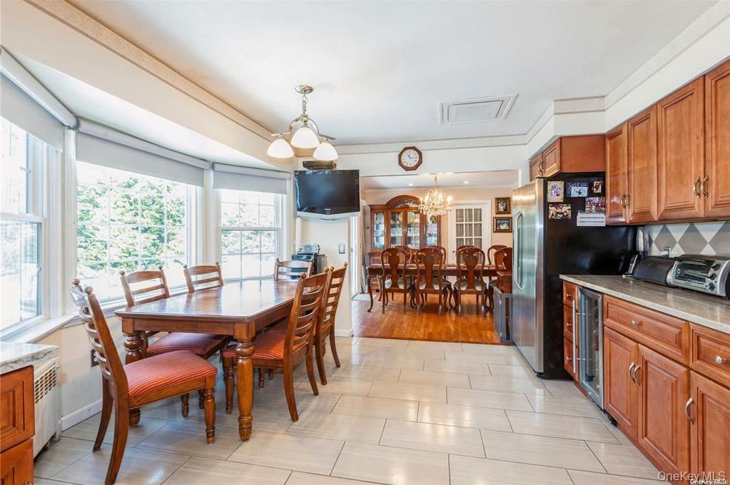77 Duck Pond Road Glen Cove, NY 11542 - Photo 17 of 36 a view of a dining room with furniture window and wooden floor