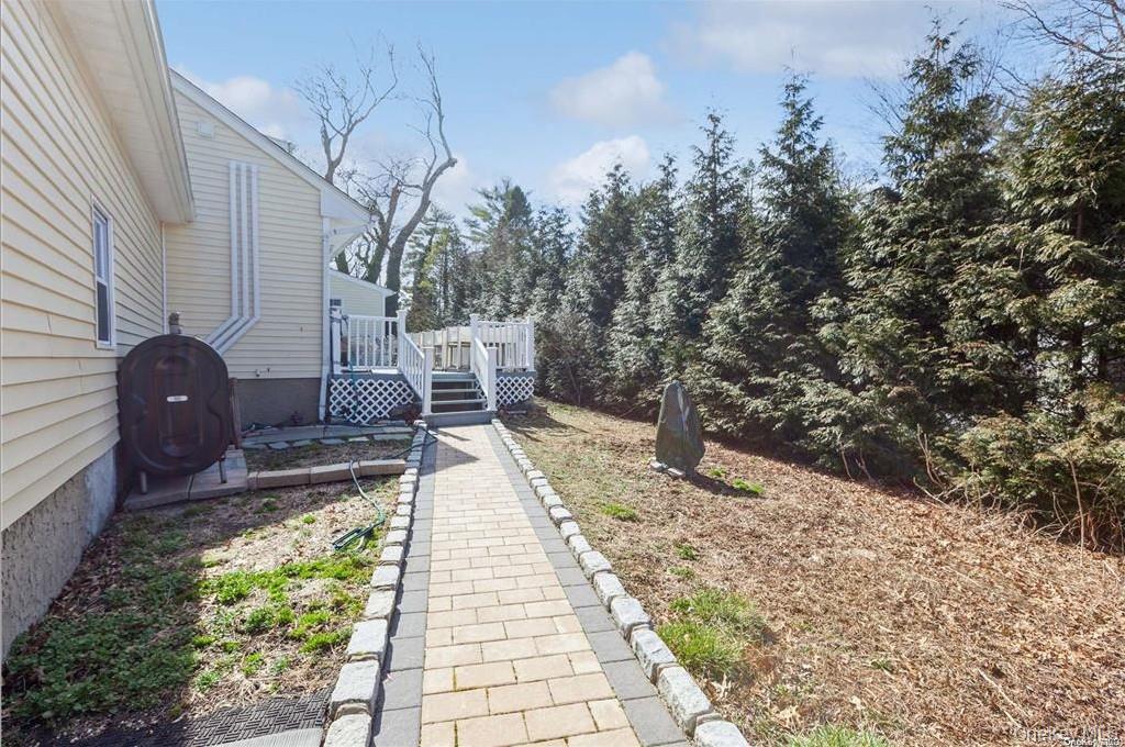 77 Duck Pond Road Glen Cove, NY 11542 - Photo 32 of 36 a view of balcony with wooden floor and seating space