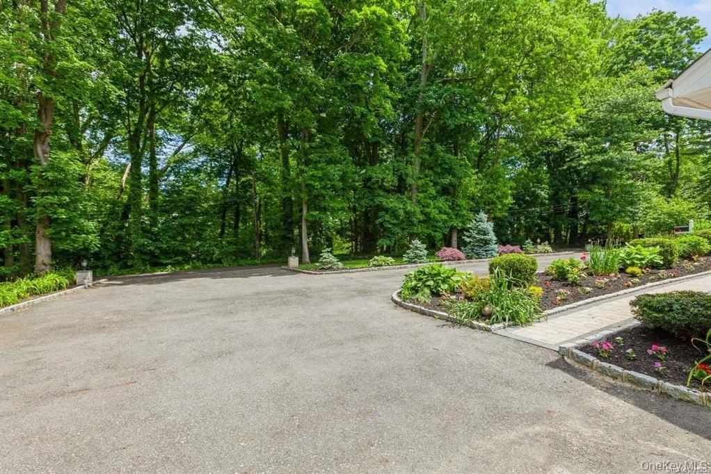 77 Duck Pond Road Glen Cove, NY 11542 - Photo 9 of 36 a view of a garden with potted plants