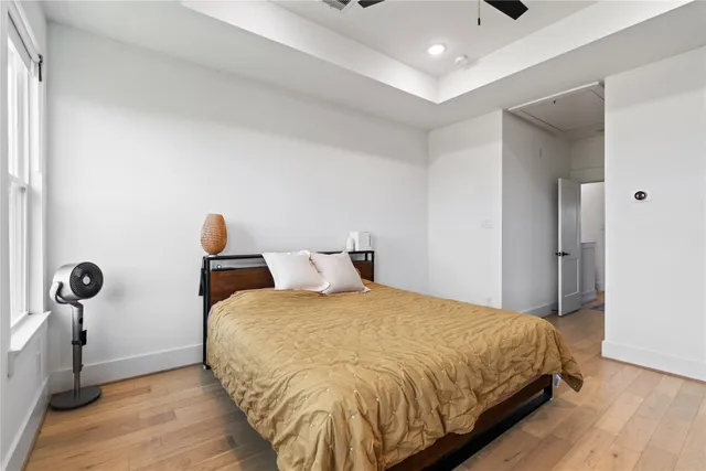 a bedroom with a bed and a table