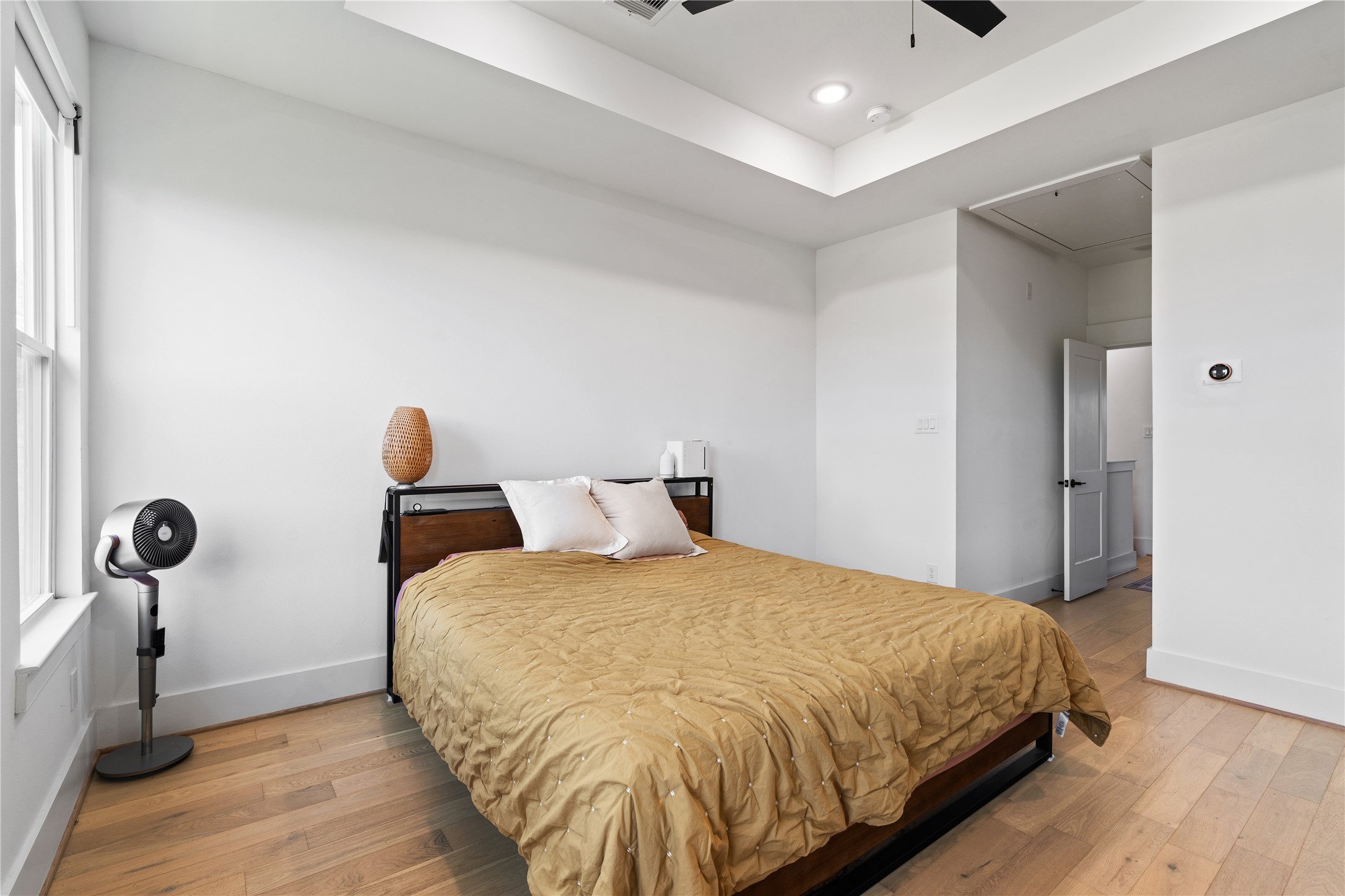 1835 Flowing Springs Trail Houston, TX 77080 - Photo 19 of 25 a bedroom with a bed and a table