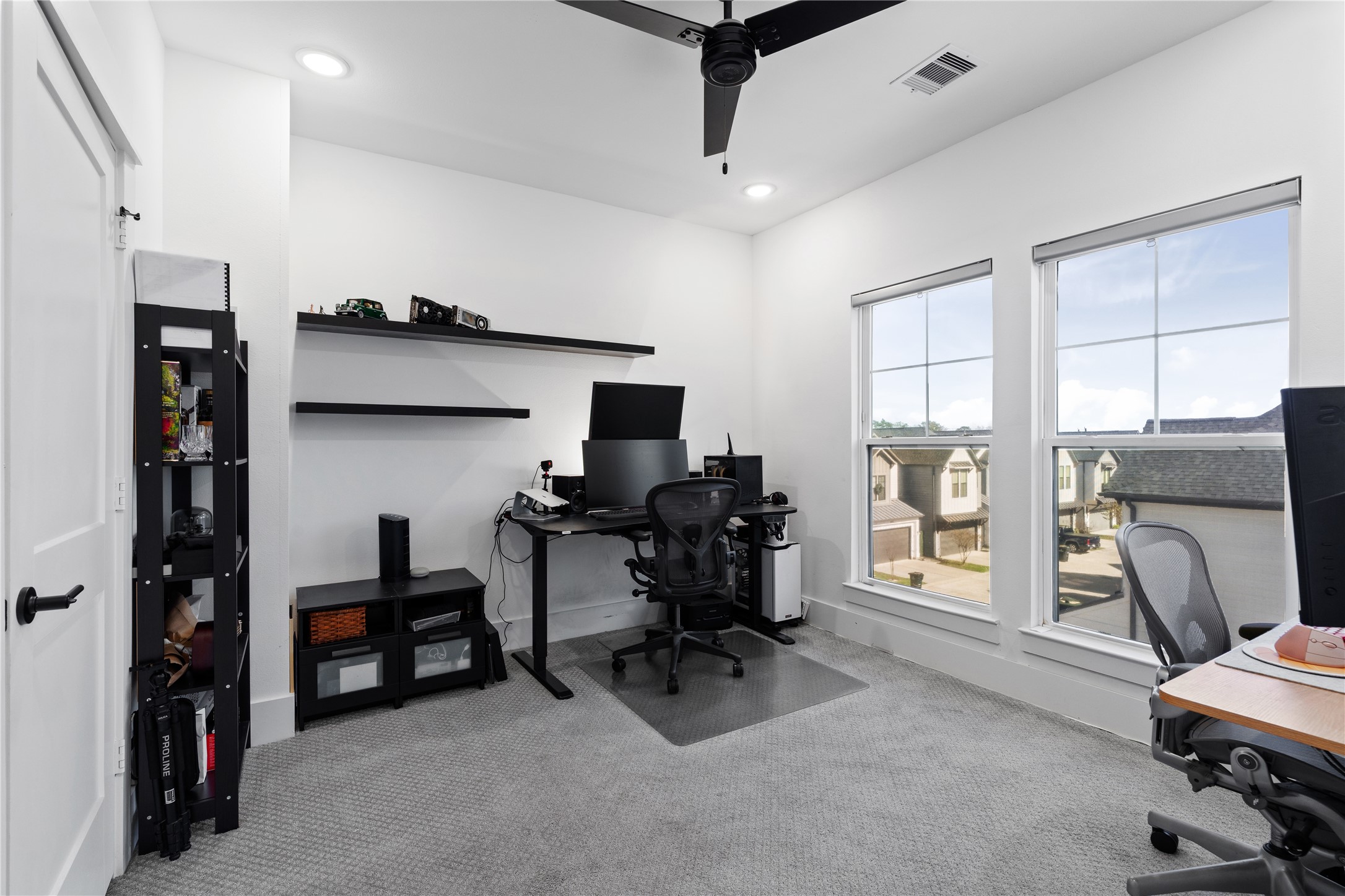 1835 Flowing Springs Trail Houston, TX 77080 - Photo 23 of 25 a view of a livingroom with workspace and a window
