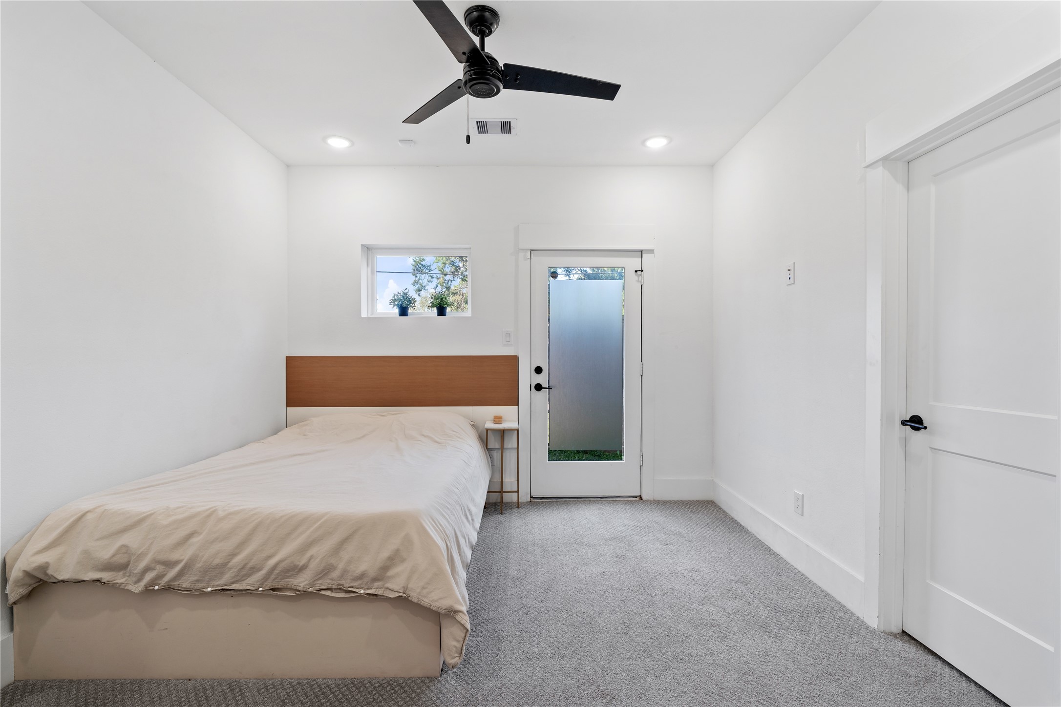 1835 Flowing Springs Trail Houston, TX 77080 - Photo 3 of 25 a spacious bedroom with a bed and a chandelier